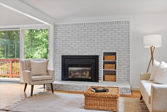 13 Long Ridge Rd, Acton, MA 01720 - sitting room with wood finished floors, healthy amount of natural light, and a fireplace