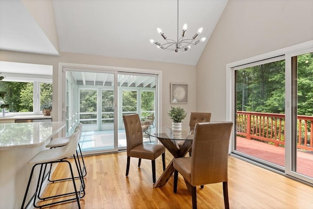 13 Long Ridge Rd, Acton, MA 01720 - dining room with a chandelier, light wood-style floors, and high vaulted ceiling