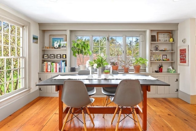 dining space with light wood-style flooring