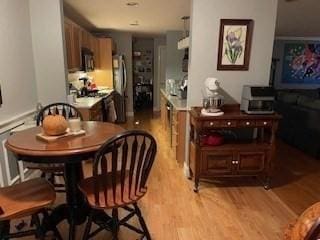 19 Broad St Unit 105, Merrimac, MA 01860 - dining space featuring light wood-style flooring