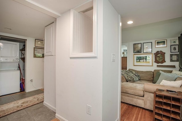 37 Raleigh Rd, Weymouth, MA 02189 - hallway featuring stacked washer / dryer and baseboards
