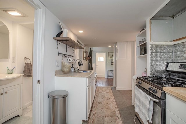 37 Raleigh Rd, Weymouth, MA 02189 - kitchen with open shelves, gas stove, a sink, light tile patterned floors, and recessed lighting