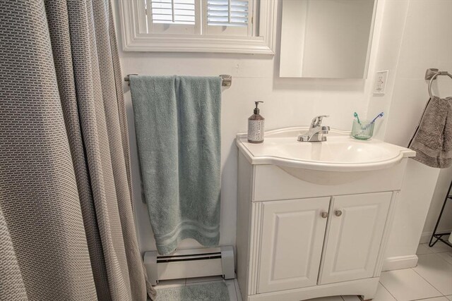 37 Raleigh Rd, Weymouth, MA 02189 - full bathroom with baseboard heating, tile patterned floors, and vanity