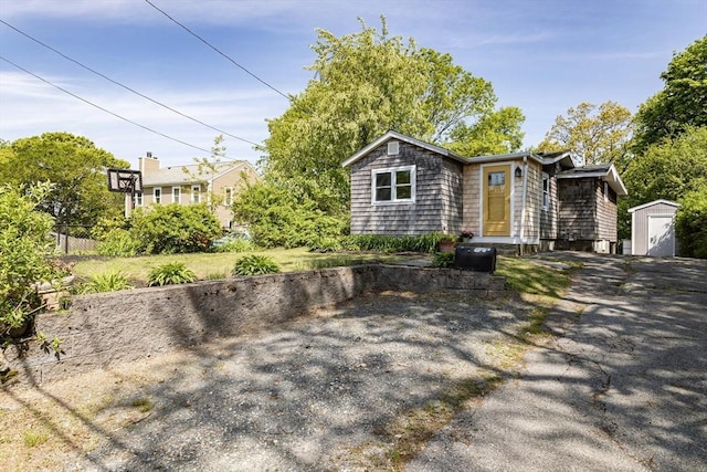 37 Raleigh Rd, Weymouth, MA 02189 - view of front of property with a storage shed, an outbuilding, and fence