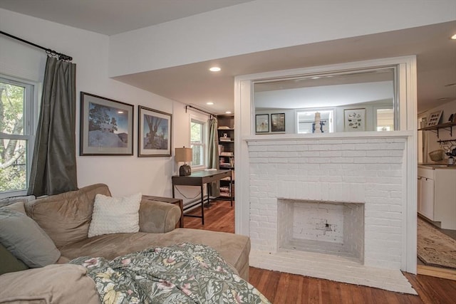 37 Raleigh Rd, Weymouth, MA 02189 - living area featuring wood finished floors, a fireplace, and healthy amount of natural light