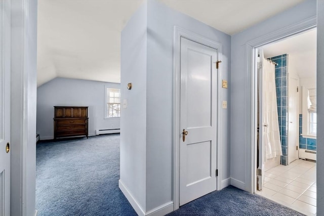 corridor featuring vaulted ceiling, carpet, and a baseboard radiator