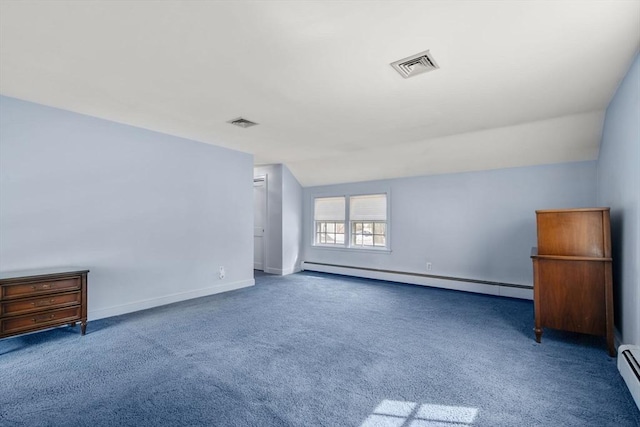 spare room featuring a baseboard heating unit, visible vents, vaulted ceiling, and carpet floors