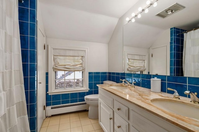 full bathroom with tile walls, a baseboard radiator, visible vents, and a sink