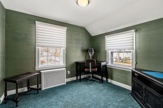 office area featuring lofted ceiling, radiator, baseboards, and dark colored carpet