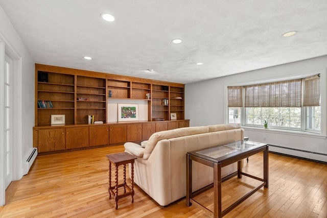 living room with built in features, recessed lighting, light wood finished floors, and baseboard heating