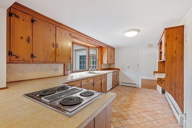 kitchen featuring stovetop with downdraft, a baseboard radiator, a sink, and dishwasher
