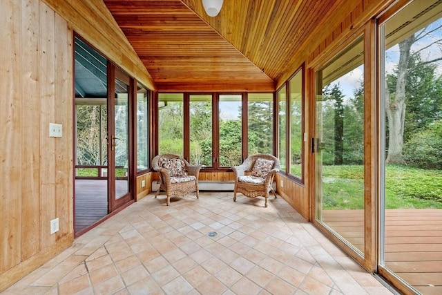 sunroom / solarium featuring baseboard heating and a healthy amount of sunlight