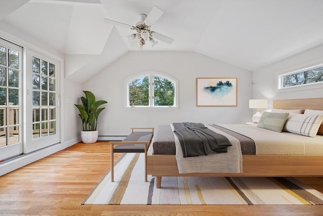 bedroom with a ceiling fan, a baseboard radiator, lofted ceiling, and wood finished floors