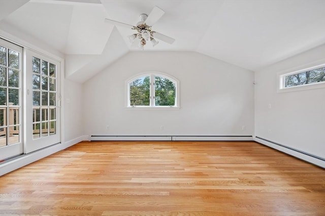 additional living space with ceiling fan, light wood-style flooring, and lofted ceiling