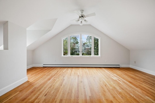 bonus room featuring a ceiling fan, baseboards, wood finished floors, and lofted ceiling