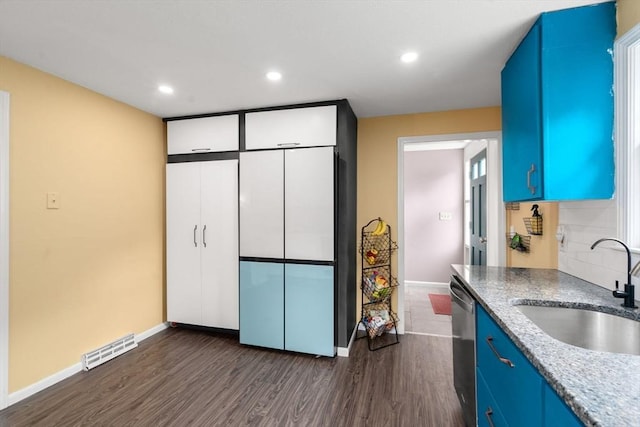 410 Central St, Acton, MA 01720 - kitchen with dishwasher, blue cabinetry, dark wood-style floors, recessed lighting, and light stone counters