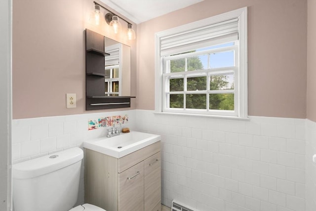 410 Central St, Acton, MA 01720 - half bathroom featuring tile walls, wainscoting, and vanity