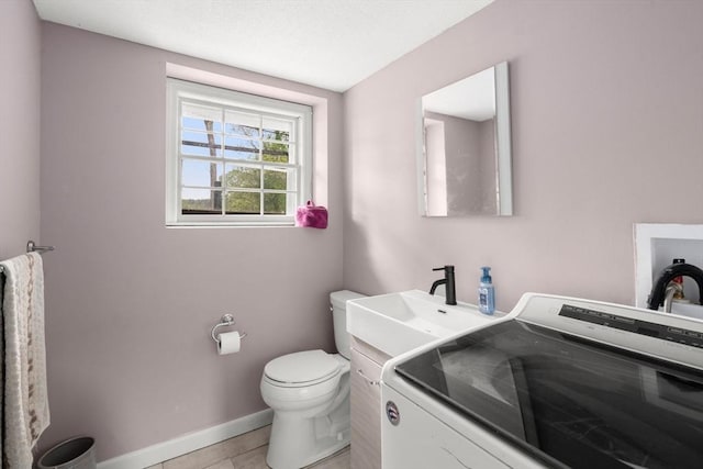 410 Central St, Acton, MA 01720 - bathroom featuring washer / clothes dryer, vanity, and tile patterned floors