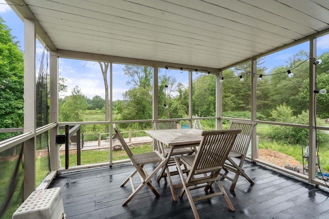 410 Central St, Acton, MA 01720 - sunroom / solarium featuring outdoor dining space, healthy amount of natural light, and view of wooded area