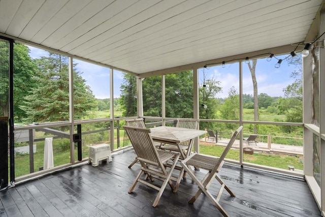 410 Central St, Acton, MA 01720 - sunroom / solarium with outdoor dining space, plenty of natural light, and view of wooded area