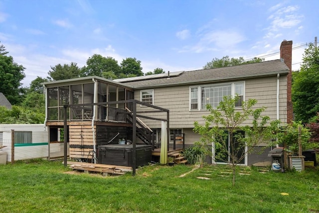 410 Central St, Acton, MA 01720 - back of property featuring a hot tub, a sunroom, solar panels, and a yard