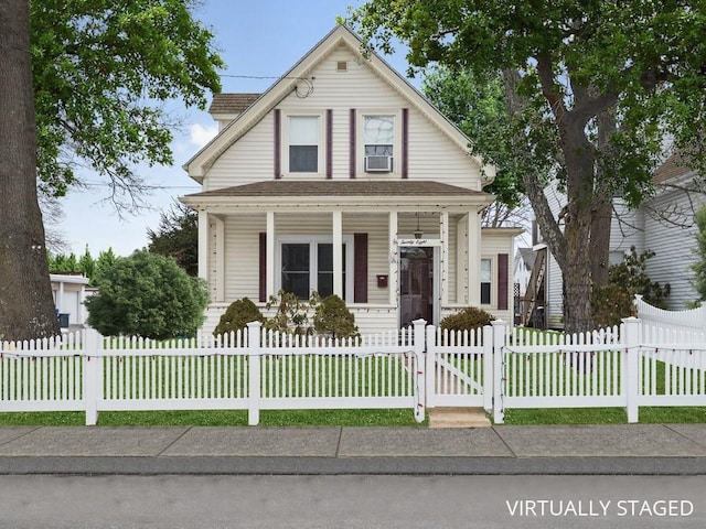 view of front facade featuring a porch, a fenced front yard, and a gate