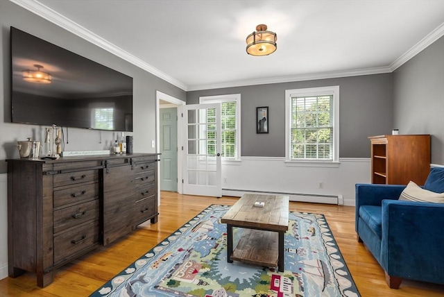67 Madison St, Amesbury, MA 01913 - living room featuring baseboard heating, crown molding, and light wood-type flooring