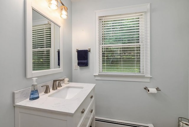 67 Madison St, Amesbury, MA 01913 - bathroom featuring baseboard heating and vanity