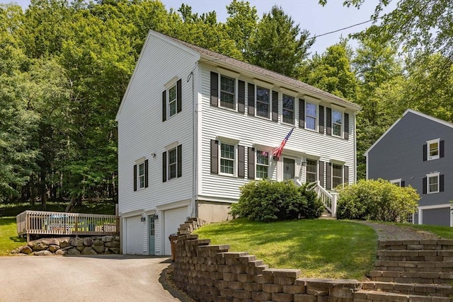 67 Madison St, Amesbury, MA 01913 - colonial house with an attached garage, driveway, and a front yard