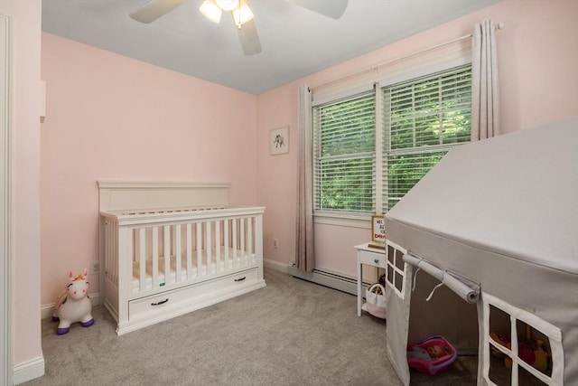 67 Madison St, Amesbury, MA 01913 - bedroom with carpet floors, a nursery area, ceiling fan, and a baseboard heating unit