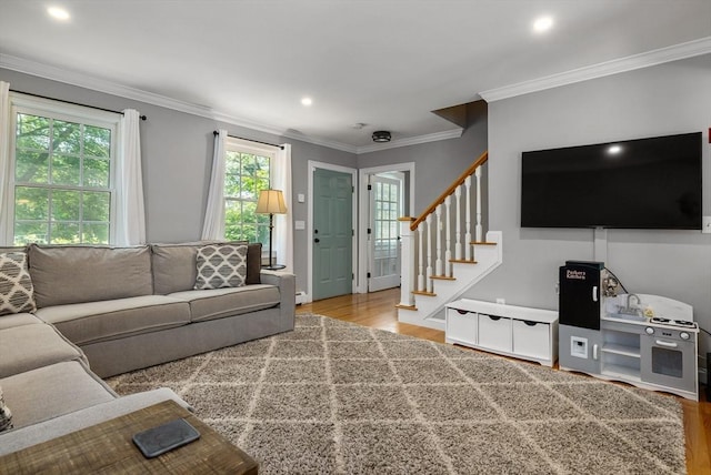 67 Madison St, Amesbury, MA 01913 - living area featuring wood finished floors, stairway, ornamental molding, and recessed lighting