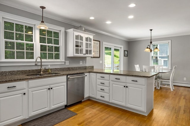 67 Madison St, Amesbury, MA 01913 - kitchen featuring dishwasher, a peninsula, light wood-style floors, white cabinetry, and plenty of natural light
