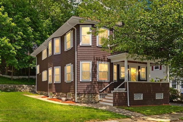 31 Sears Ave, Melrose, MA 02176 - view of front of house featuring a front lawn and covered porch