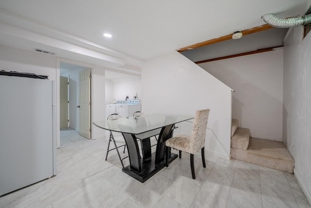 dining area featuring washer and dryer, stairway, recessed lighting, and baseboards