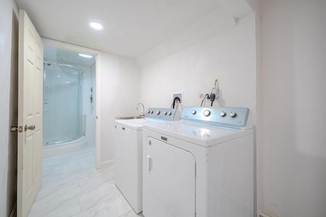 washroom featuring washing machine and dryer, recessed lighting, and baseboards