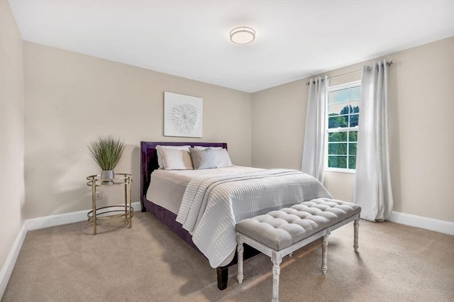 bedroom featuring light colored carpet