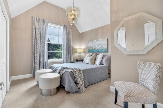 carpeted bedroom with an inviting chandelier, vaulted ceiling, and a closet