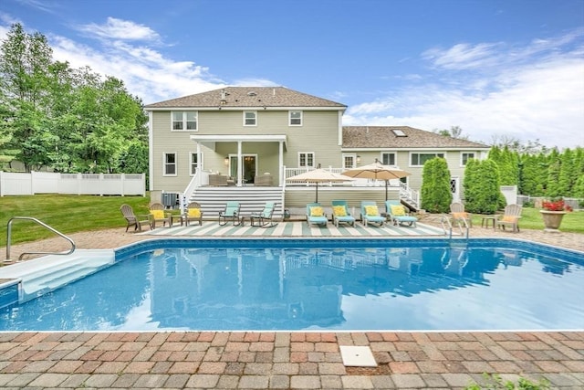 view of swimming pool featuring a patio area, a yard, and cooling unit