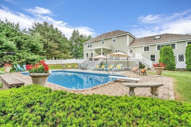 72 Rinnock Rd, Fitchburg, MA 01420 - view of swimming pool with stairs, a patio, a diving board, and a wooden deck