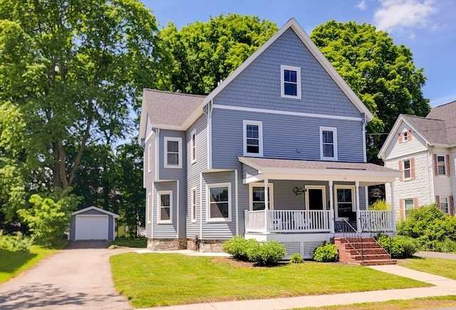 38 Oneil St, Hudson, MA 01749 - american foursquare style home with covered porch, an outbuilding, asphalt driveway, and a front yard