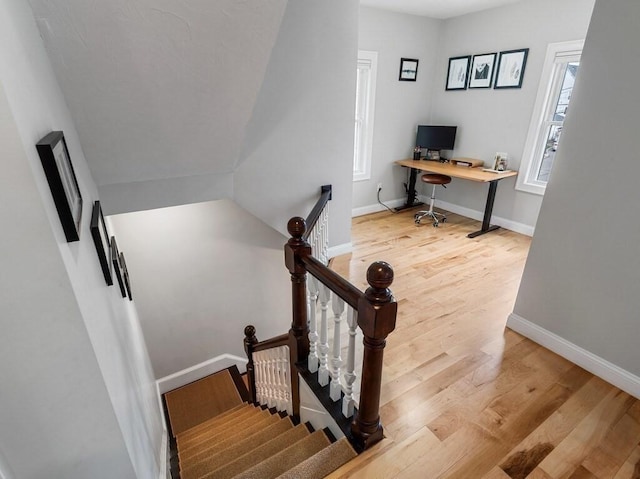 38 Oneil St, Hudson, MA 01749 - stairway with wood finished floors, plenty of natural light, and baseboards
