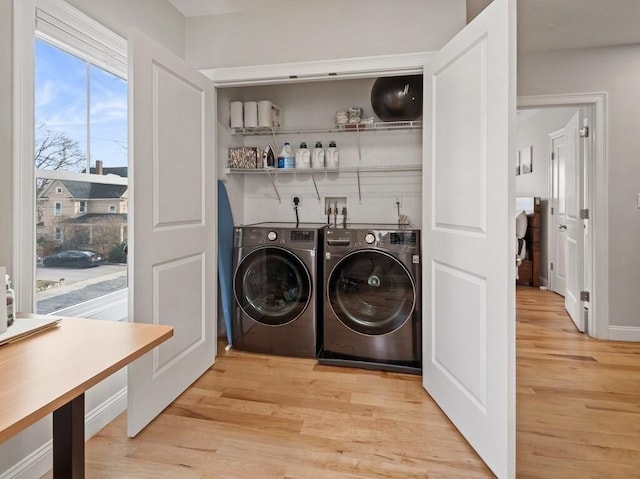 38 Oneil St, Hudson, MA 01749 - laundry room with washer and dryer and light wood-style floors