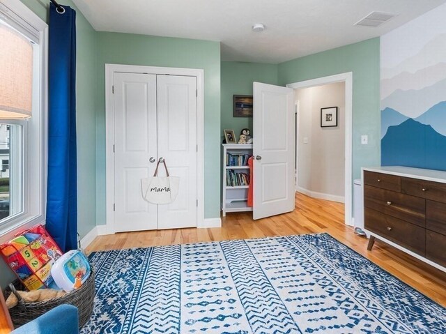 38 Oneil St, Hudson, MA 01749 - bedroom with light wood-type flooring, baseboards, and a closet