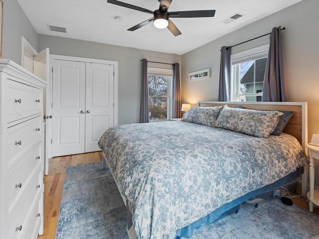 38 Oneil St, Hudson, MA 01749 - bedroom featuring light wood-style floors, a closet, multiple windows, and ceiling fan