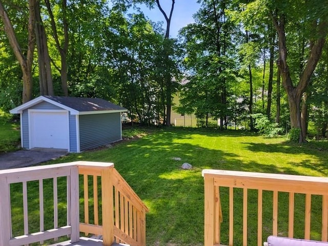 38 Oneil St, Hudson, MA 01749 - view of grassy yard with an outbuilding, a detached garage, and driveway