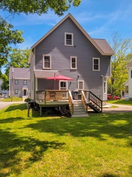 38 Oneil St, Hudson, MA 01749 - back of property featuring a deck and a yard