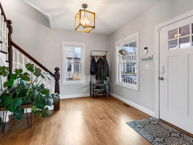 38 Oneil St, Hudson, MA 01749 - foyer entrance with stairs, wood finished floors, and plenty of natural light