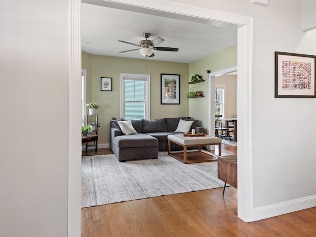 38 Oneil St, Hudson, MA 01749 - living area featuring wood finished floors, plenty of natural light, a ceiling fan, and baseboards