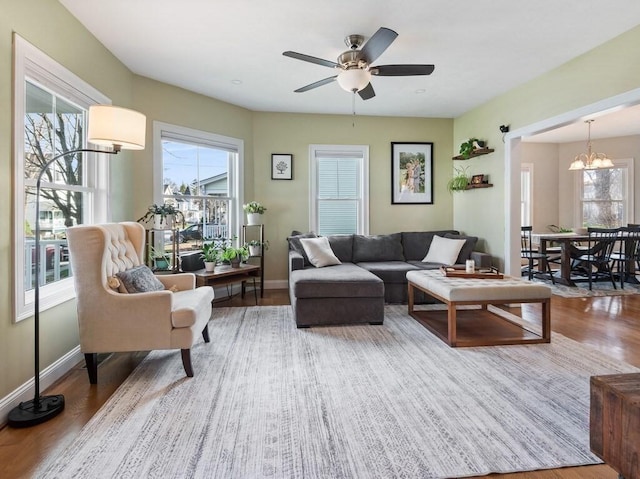 38 Oneil St, Hudson, MA 01749 - living area featuring wood finished floors, ceiling fan, a chandelier, and baseboards
