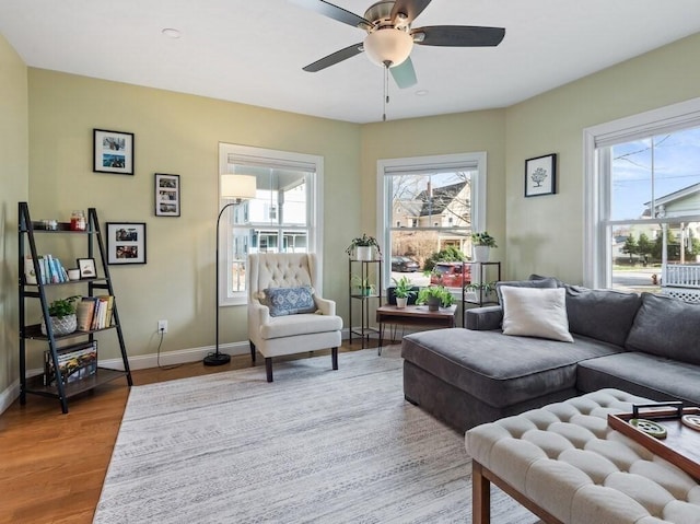38 Oneil St, Hudson, MA 01749 - living area featuring plenty of natural light, wood finished floors, a ceiling fan, and baseboards